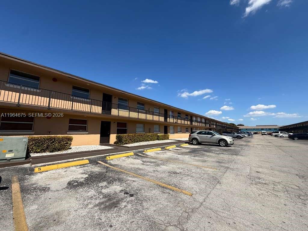 a view of a car park in front of building