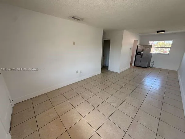 a view of an empty room and window