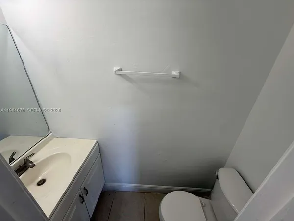 a bathroom with a sink and toilet