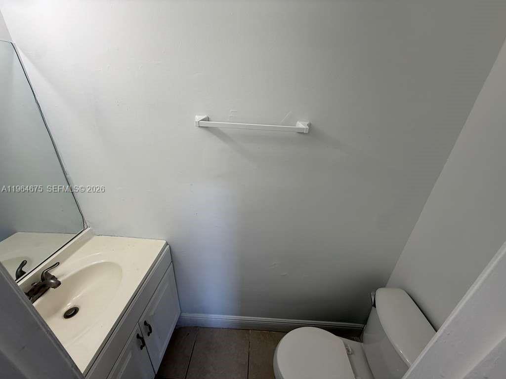 5491 West 24th Avenue, Unit 39 Hialeah, FL 33016 - Photo 8 of 12 a bathroom with a sink and toilet