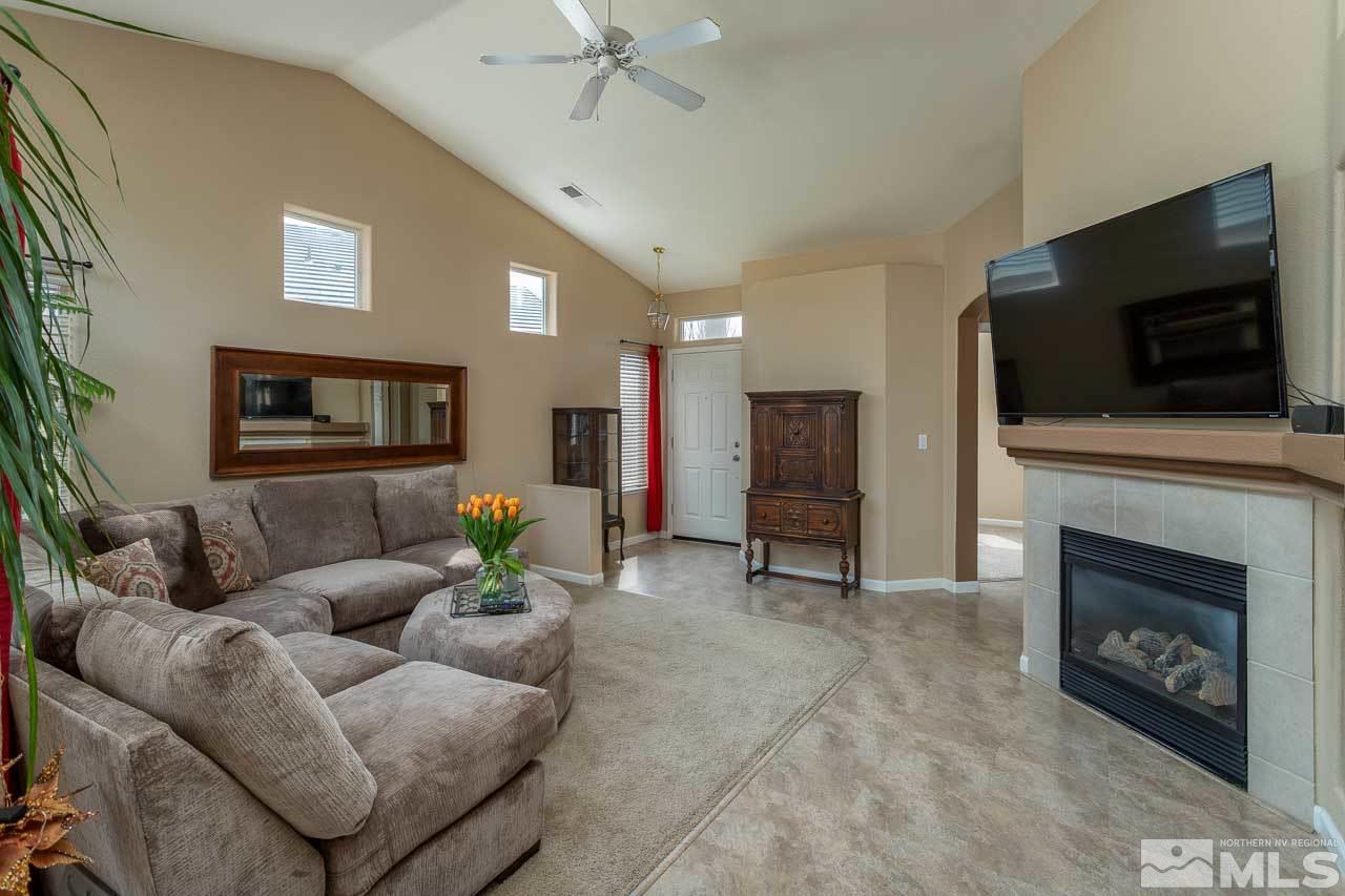 1815 D'Arques Court Reno, NV 89521 - Photo 3 of 16 a living room with furniture and a flat screen tv