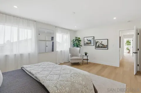 a bedroom with a bed and furniture