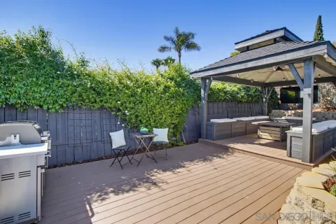 a view of a backyard with sitting area