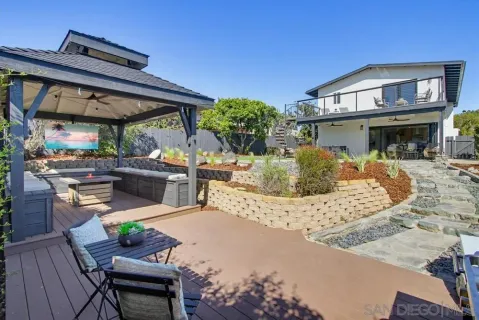 a view of a house with backyard porch and patio