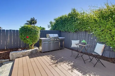 a view of a chairs and table in the patio