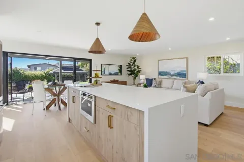 a very nice looking living room with a large window