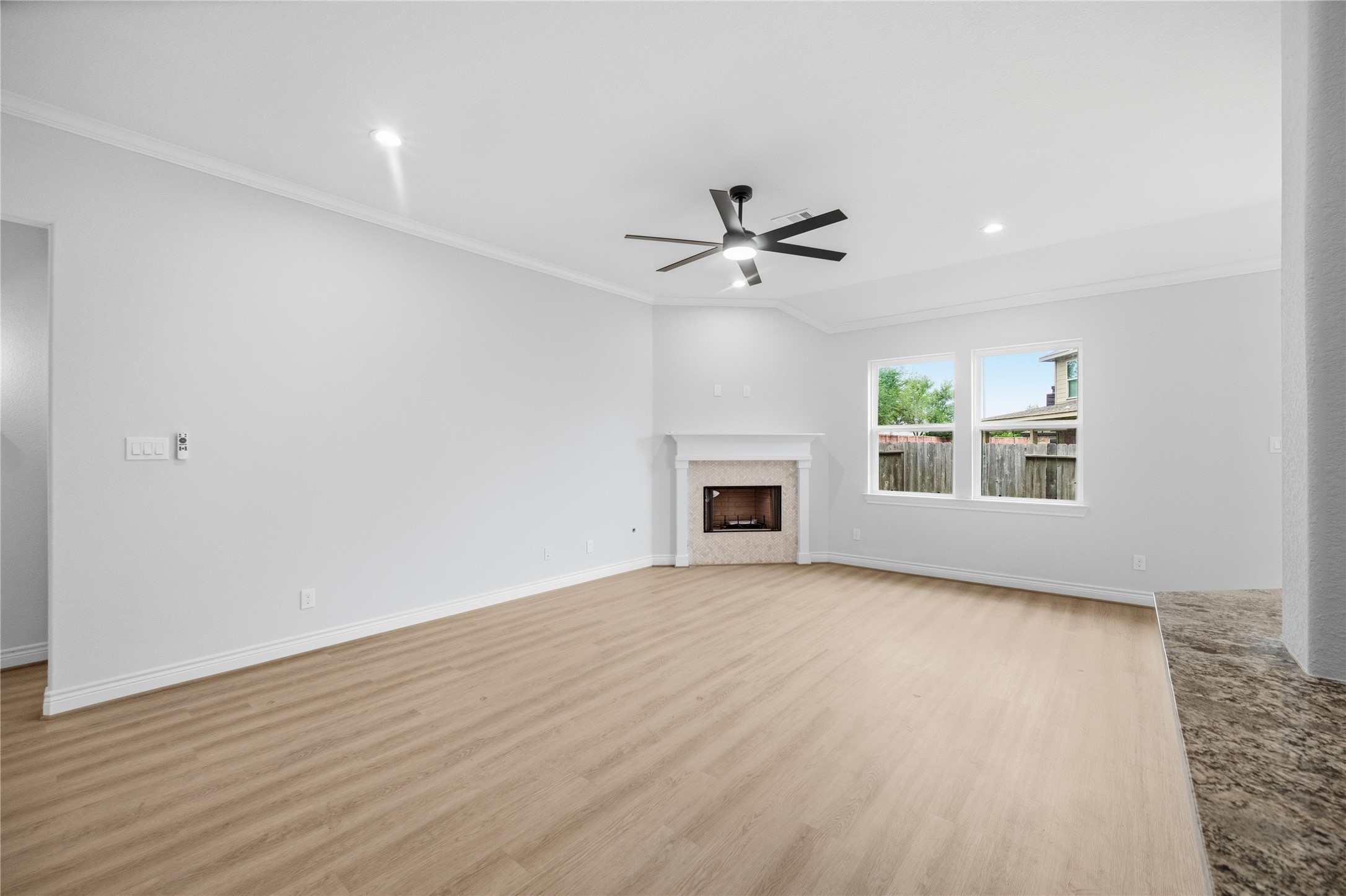 114 Par Circle La Porte, TX 77571 - Photo 7 of 33 The family room is filled with natural light and features a fireplace as its focal point.
