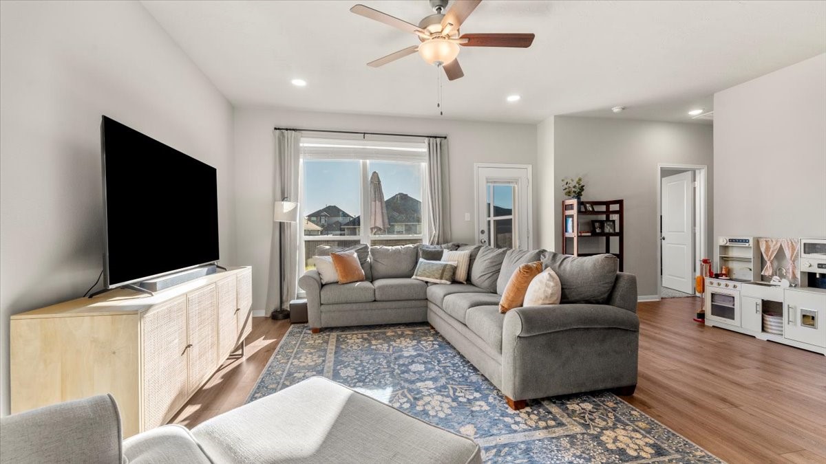 103 Rudder Way Huntsville, TX 77320 - Photo 13 of 35 a living room with furniture and a flat screen tv