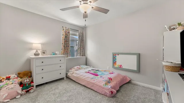 a bedroom with a bed and a dresser