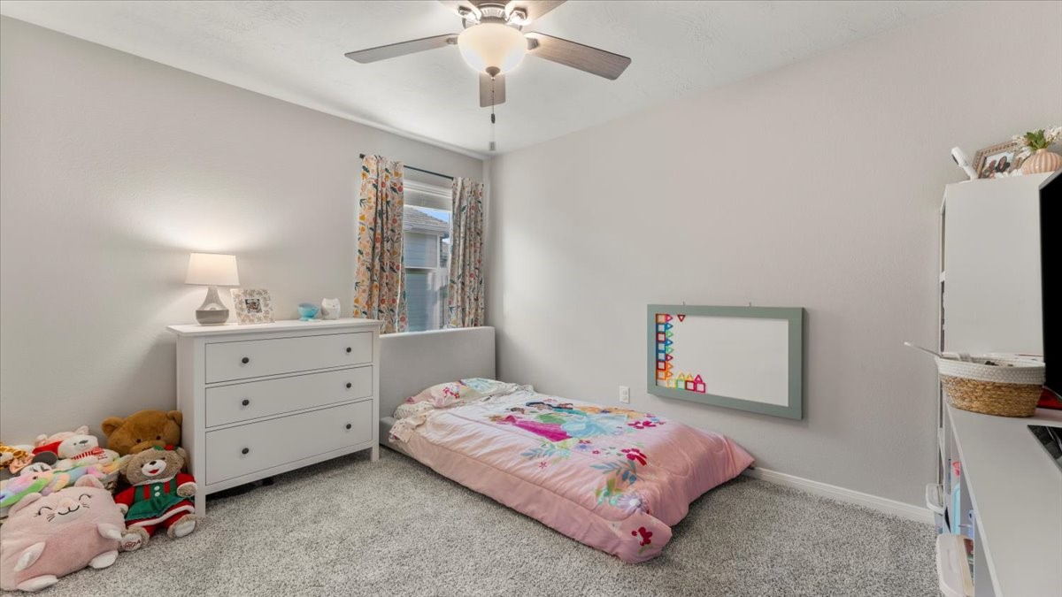 103 Rudder Way Huntsville, TX 77320 - Photo 20 of 35 a bedroom with a bed and a dresser