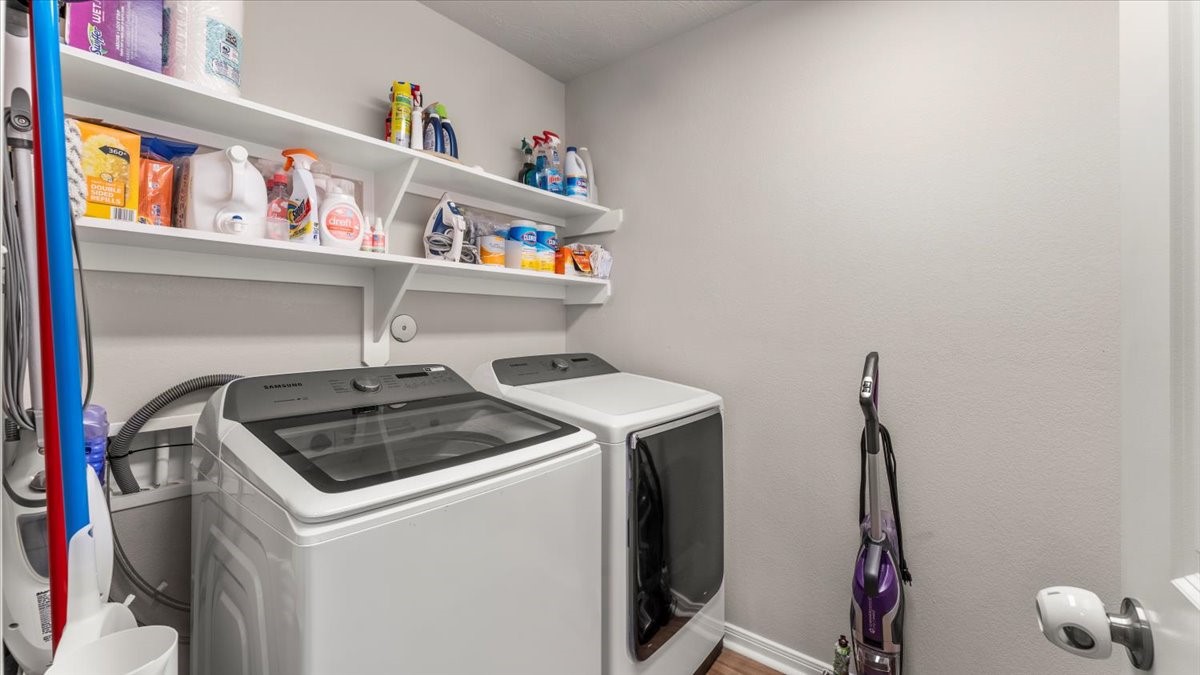 103 Rudder Way Huntsville, TX 77320 - Photo 26 of 35 a utility room with dryer and washer