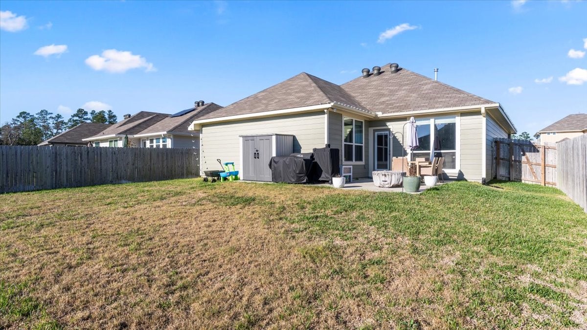 103 Rudder Way Huntsville, TX 77320 - Photo 29 of 35 a front view of a house with a yard and garage