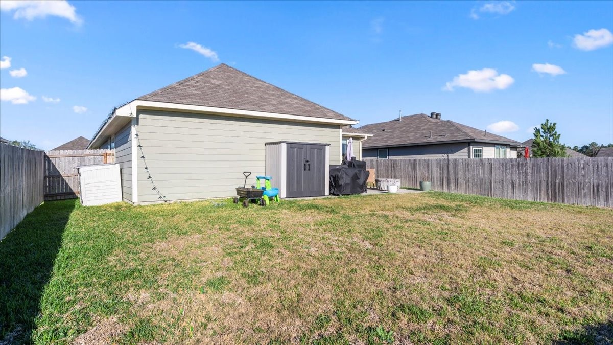 103 Rudder Way Huntsville, TX 77320 - Photo 30 of 35 a view of a house with a yard and wooden fence