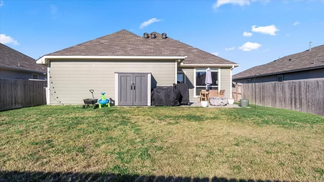 a front view of house with yard and seating space