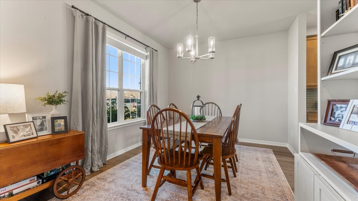 103 Rudder Way Huntsville, TX 77320 - Photo 6 of 35 a view of a dining room with furniture window and wooden floor