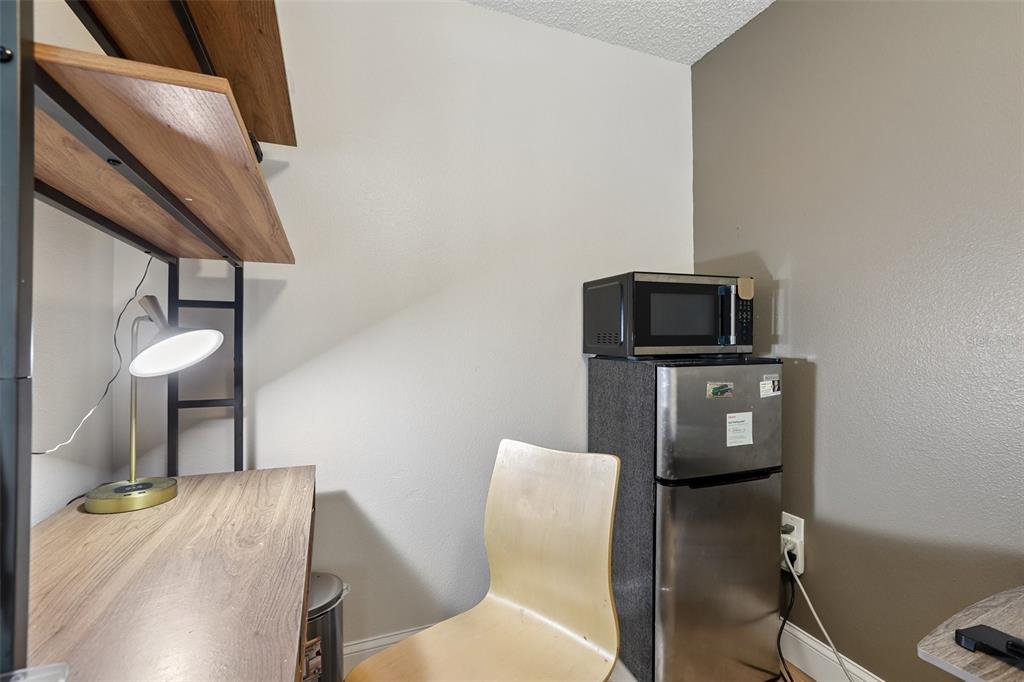 1525 Kestrel Way Brandon, FL 33511 - Photo 25 of 48 a living room with furniture and a flat screen tv