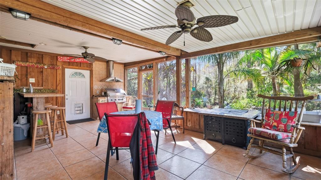 10565 Bessemer Street New Port Richey, FL 34654 - Photo 30 of 72 a view of a dining room with furniture window and outside view