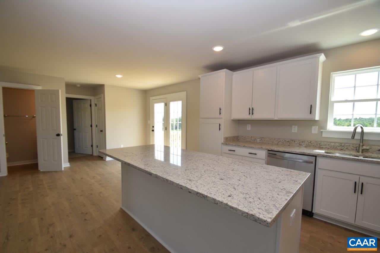4305 Cedar Lane Road Kents Store, VA 23084 - Photo 24 of 27 a kitchen with granite countertop a sink a stove and cabinets