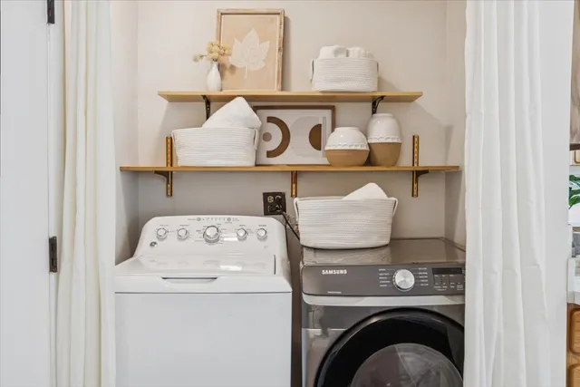 a utility room with dryer and washer
