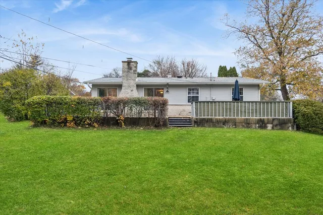 a view of a house with a back yard