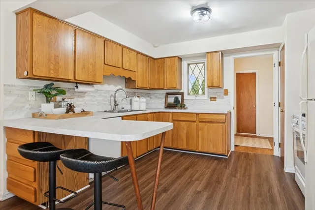 a kitchen with a sink cabinets and window