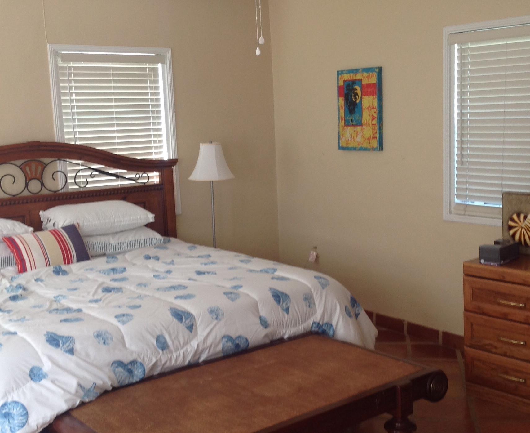 337 East 25th Street Riviera Beach, FL 33404 - Photo 7 of 7 a bedroom with a bed and a table in it