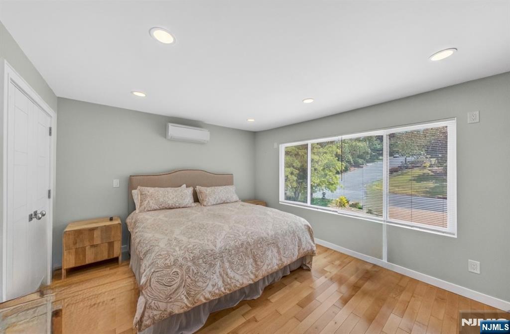 57 Hemlock Road Little Falls, NJ 07424 - Photo 26 of 50 a bedroom with a bed and a window