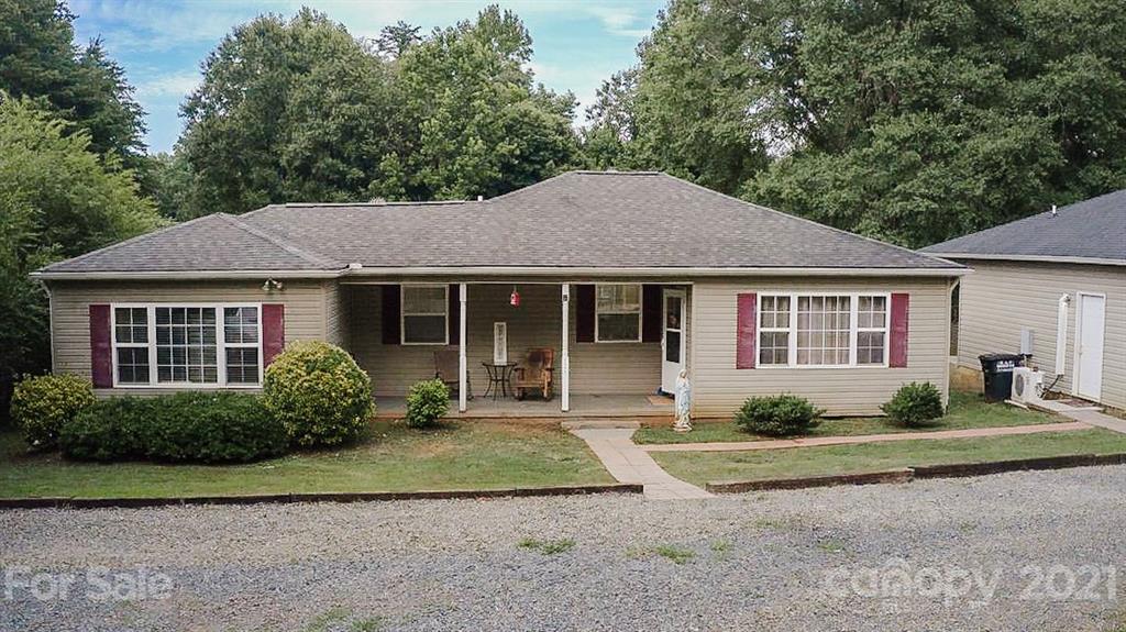 7345 Pop Basinger Road Salisbury, NC 28146 - Photo 1 of 38 a front view of a house with garden