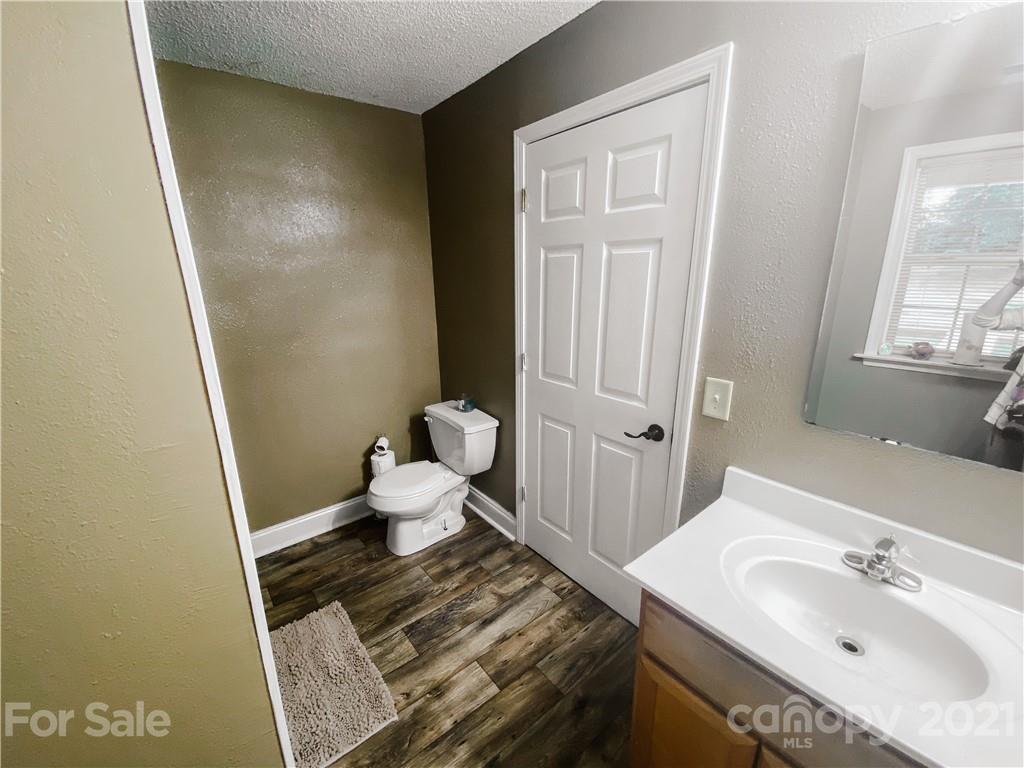 7345 Pop Basinger Road Salisbury, NC 28146 - Photo 22 of 38 a bathroom with a sink and a mirror