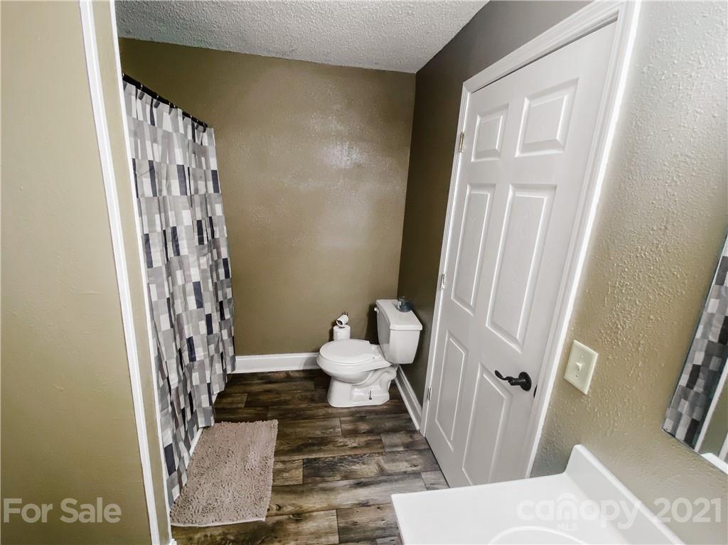 7345 Pop Basinger Road Salisbury, NC 28146 - Photo 23 of 38 a bathroom with a sink and toilet