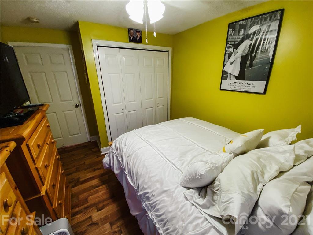 7345 Pop Basinger Road Salisbury, NC 28146 - Photo 29 of 38 a bedroom with a bed and a flat screen tv