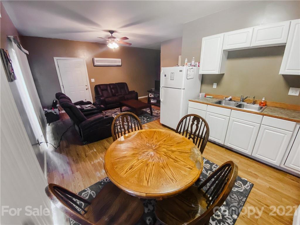 7345 Pop Basinger Road Salisbury, NC 28146 - Photo 33 of 38 a living room with furniture and a table