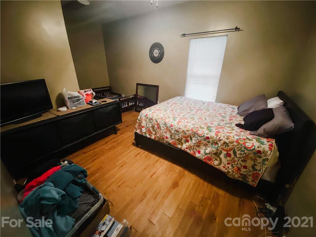 7345 Pop Basinger Road Salisbury, NC 28146 - Photo 34 of 38 a bedroom with a bed and a window