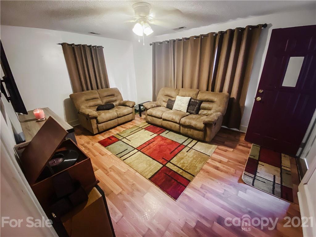 7345 Pop Basinger Road Salisbury, NC 28146 - Photo 7 of 38 a bedroom with furniture and a wooden floor