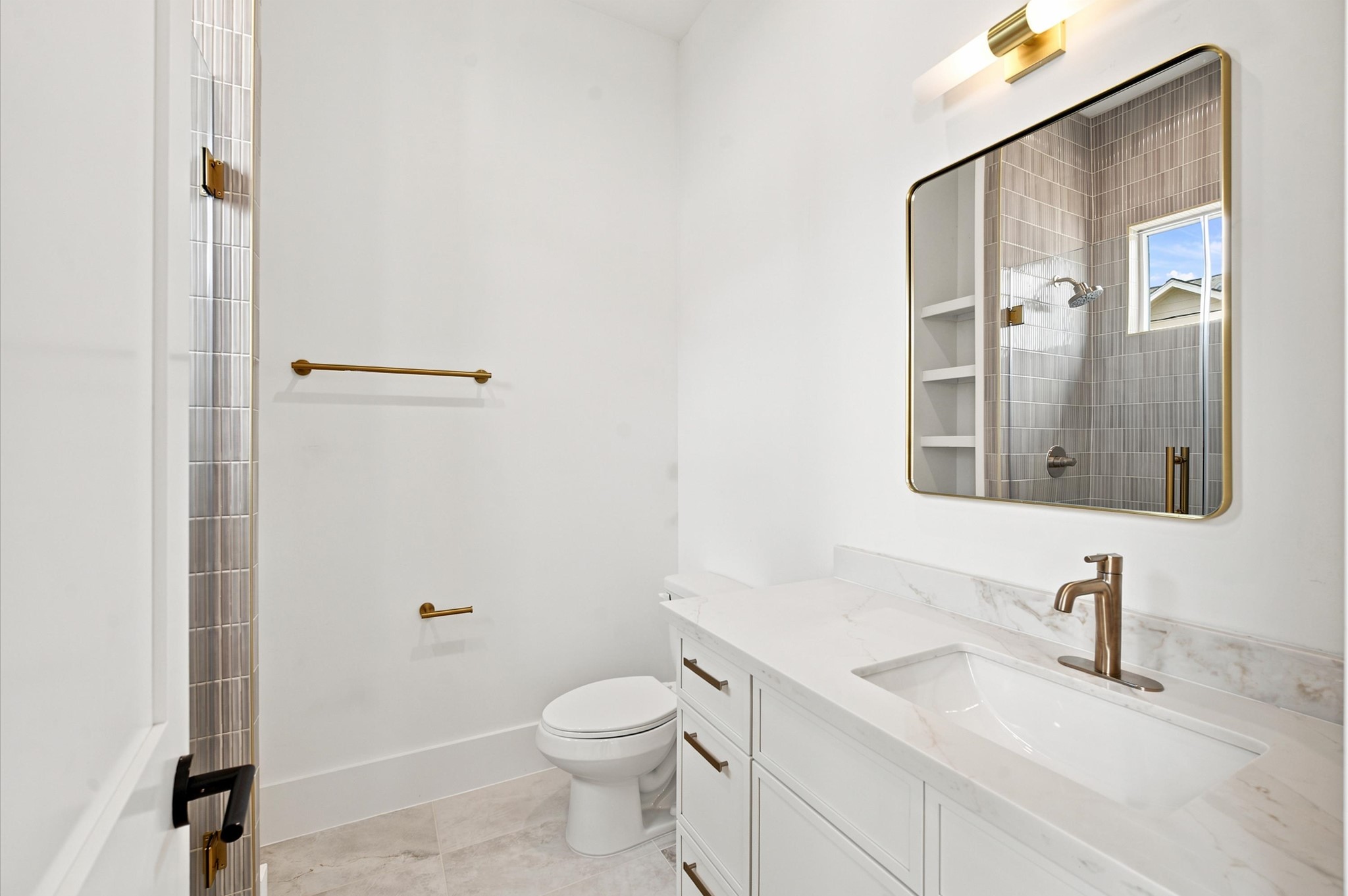 112 East 27th Street Houston, TX 77008 - Photo 31 of 43 Bathroom vanity has quartz countertops and premium lighting.