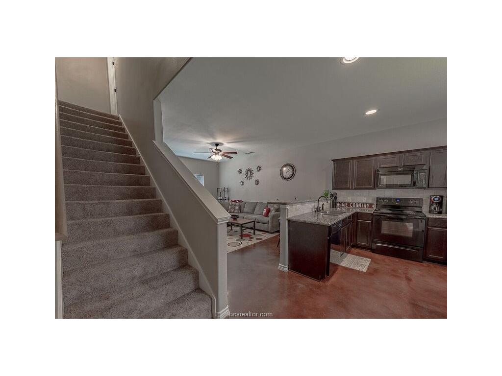 129 Watson Lane Bryan, TX 77801 - Photo 14 of 20 a kitchen with a cabinets and counter