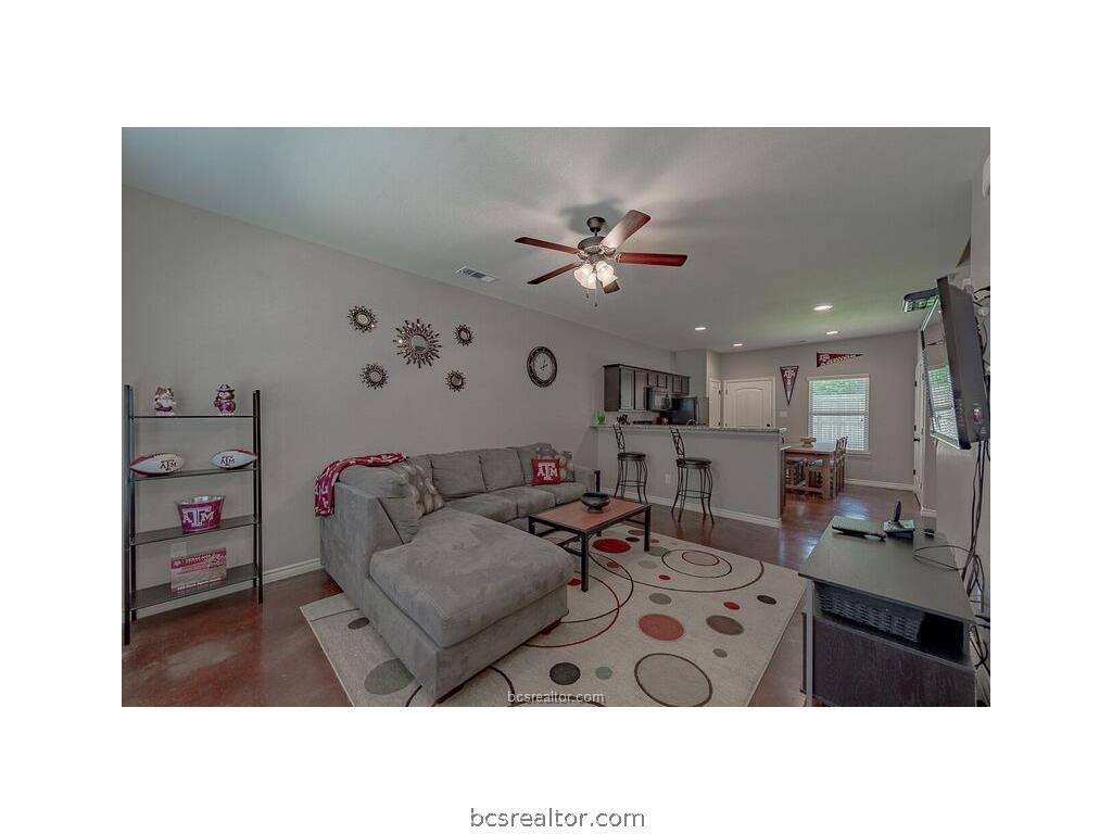 129 Watson Lane Bryan, TX 77801 - Photo 2 of 20 a living room with furniture and a view of kitchen