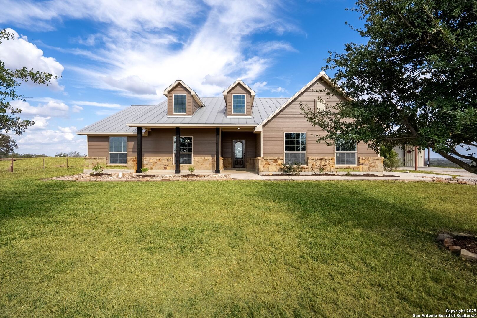 a front view of a house with garden