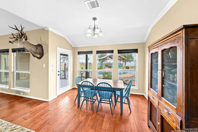 a spacious bathroom with a double vanity sink a mirror and a shower