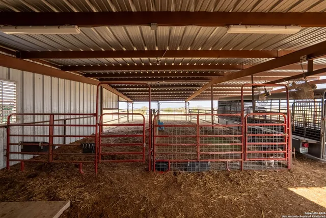 a view of a house with swimming pool and sitting area