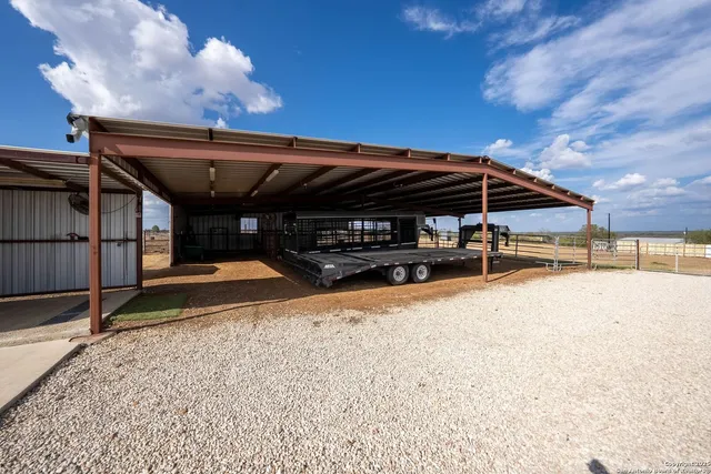 a view of a swimming pool with an outdoor space and seating area
