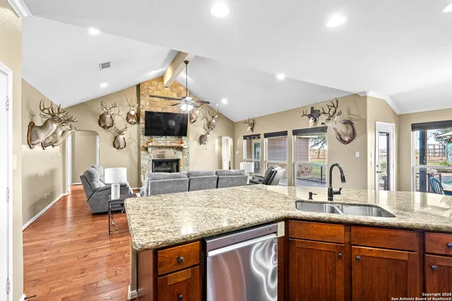 a spacious bedroom with a bed and a chandelier