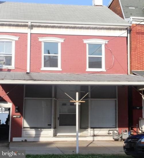 a kitchen with a sink and a mirror