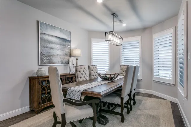 a view of a dining room with furniture and window