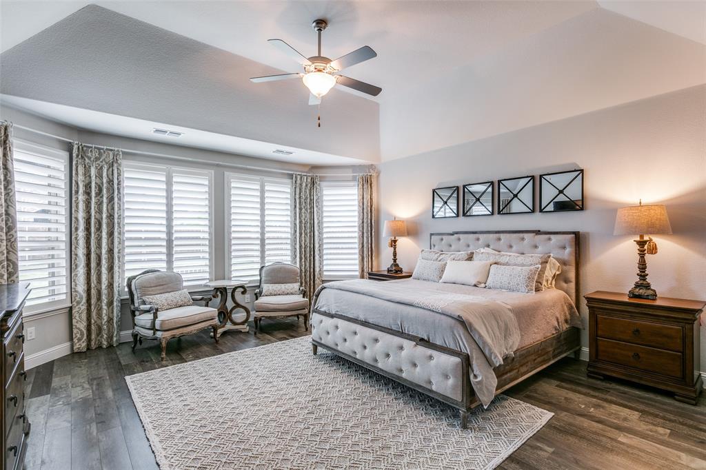 1801 Wichita Drive Prosper, TX 75078 - Photo 25 of 36 a bedroom with a large bed and a couch