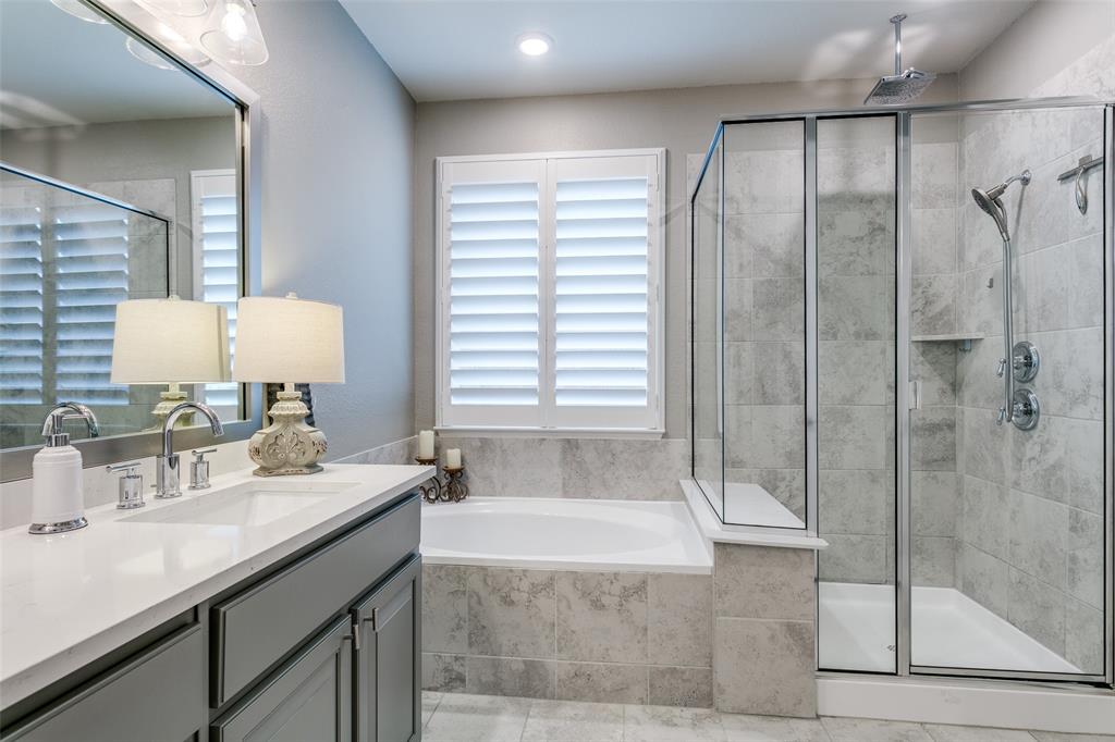 1801 Wichita Drive Prosper, TX 75078 - Photo 27 of 36 a bathroom with a granite countertop sink a mirror and shower
