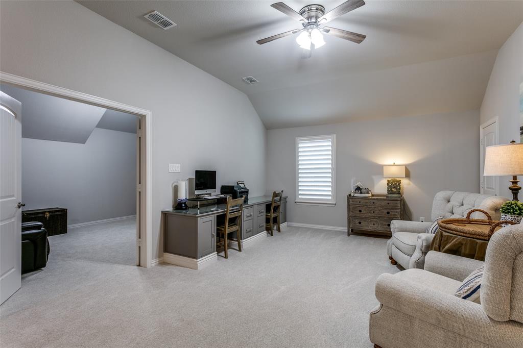 1801 Wichita Drive Prosper, TX 75078 - Photo 28 of 36 a living room with furniture and a chandelier