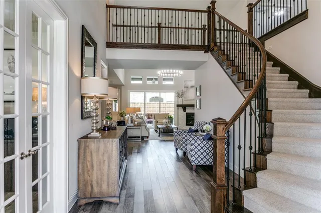 a view of entryway and hall with wooden floor