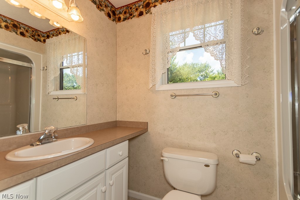 7710 Brakeman Road Painesville, OH 44077 - Photo 23 of 34 Bathroom with vanity and toilet