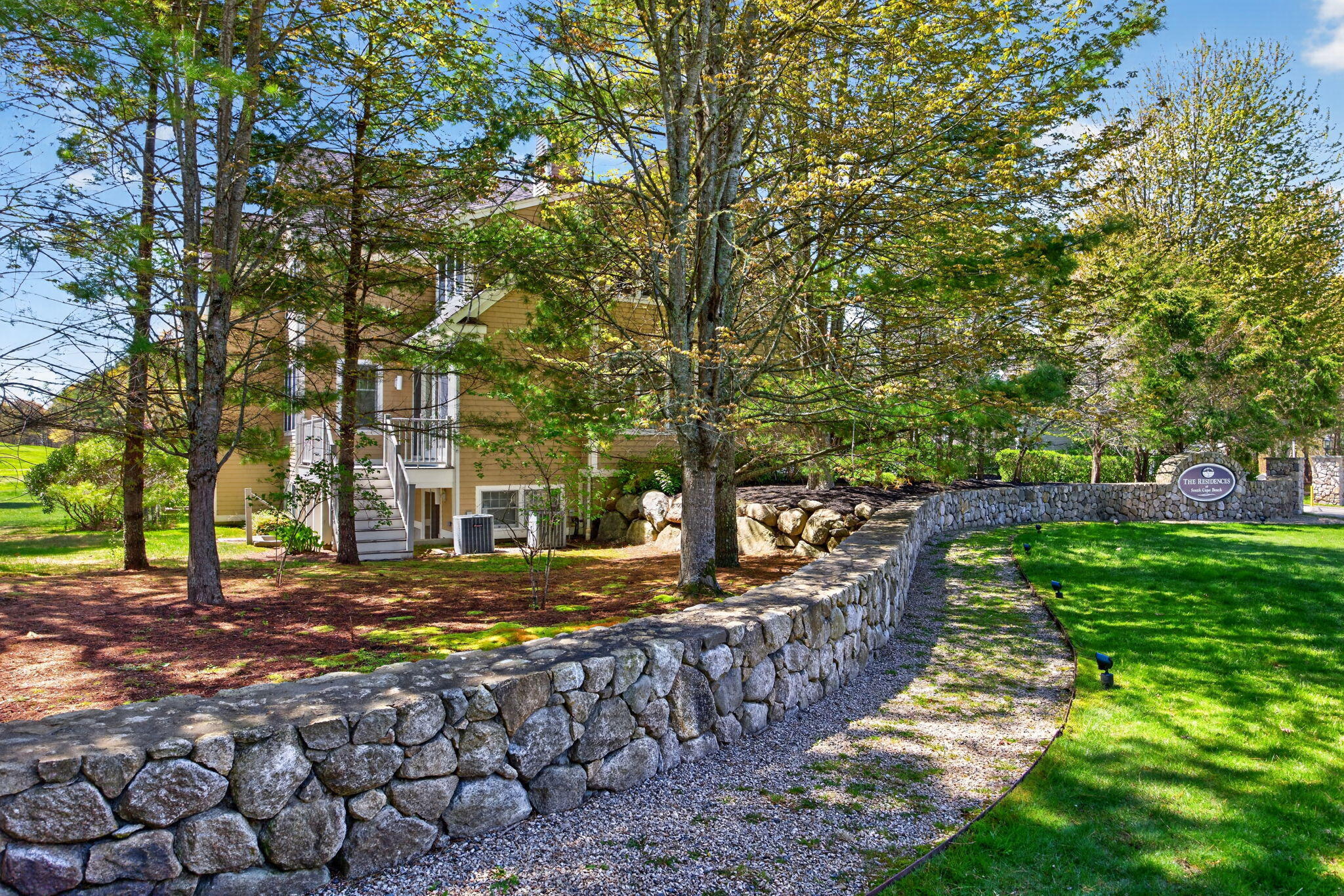 2 Quinns Way, Unit 2 Mashpee, MA 02649 - Photo 43 of 49 backyard area with stone wall